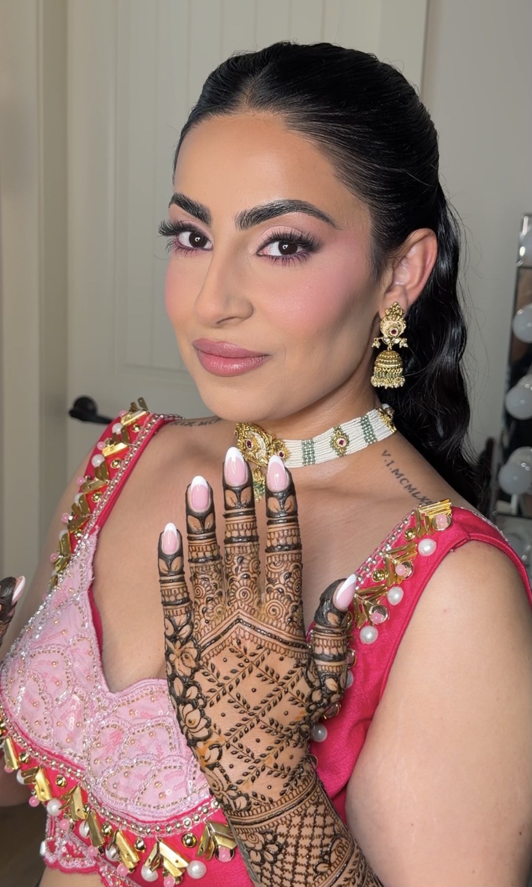 Makeup look — pink semi-bridal with mehndi detail