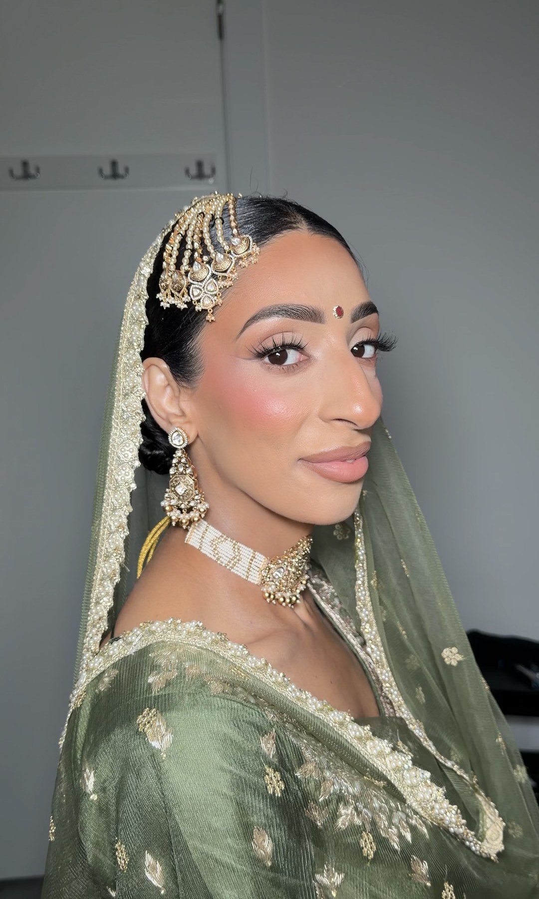 Bridal look — sage green dupatta with matha patti