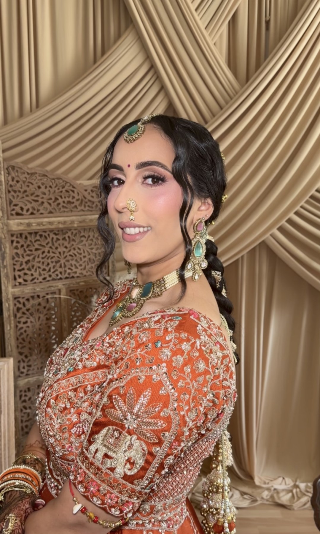 Bridal look — rust orange lehenga with nath